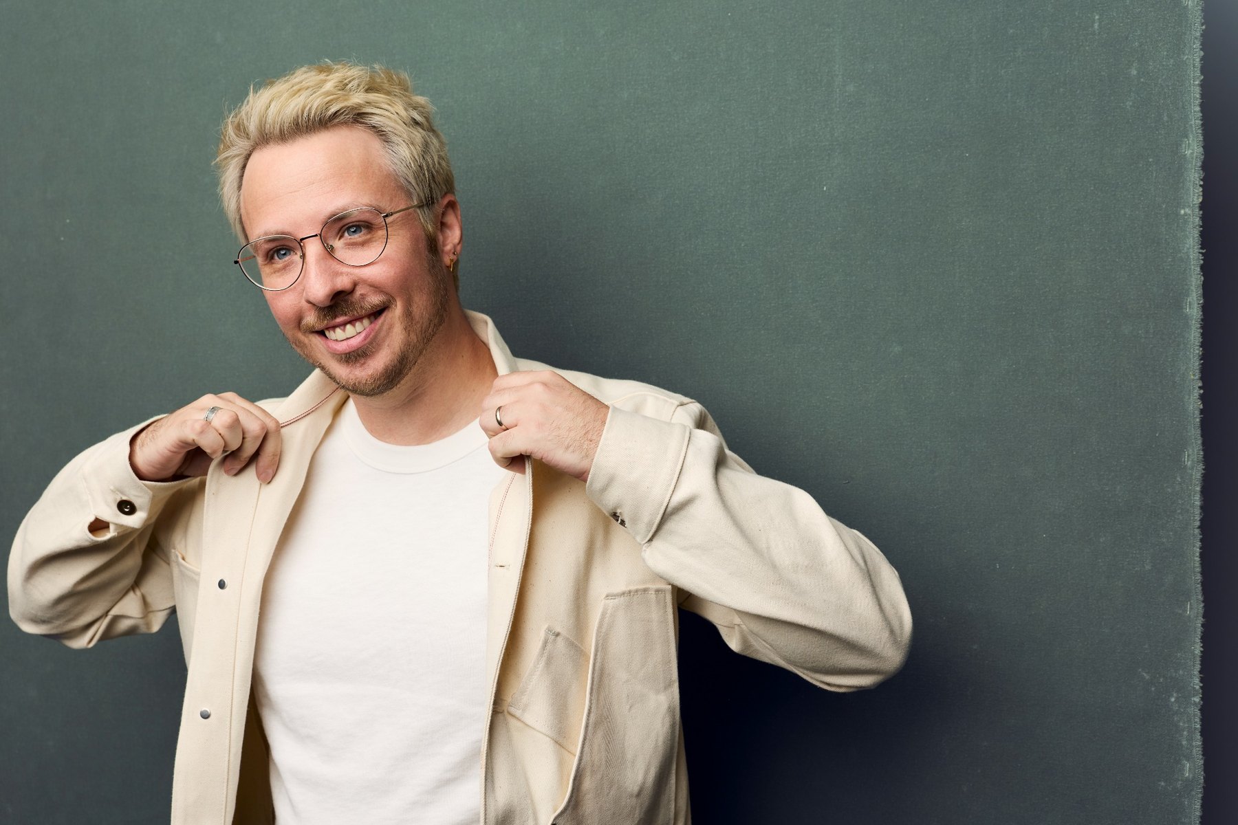 Scott Goldbaum in glasses and a cream jacket