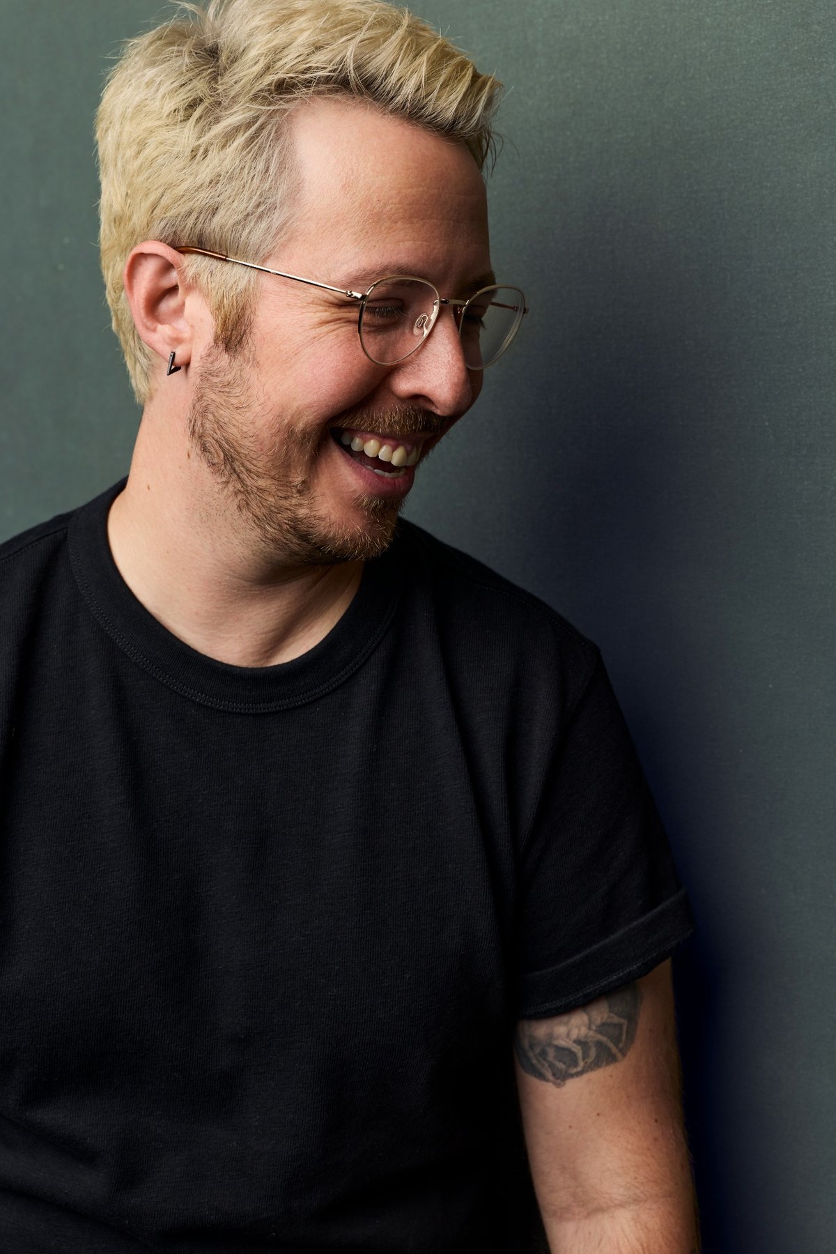 Scott Goldbaum laughing in glasses